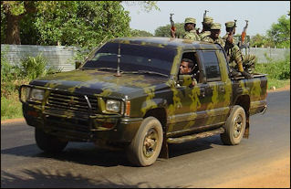 20120710-LTTE_car_with_soldiers_in_Killinochi_april_2004.jpg